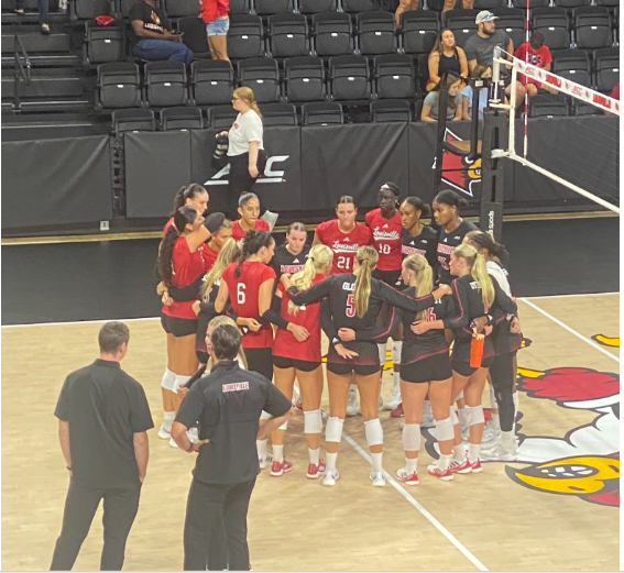 Louisville Volleyball huddles as a team concluding the Red vs Black scrimmage on August 17. The Red team won 4-0 (25-18, 25-17, 25-12, 27-25)

