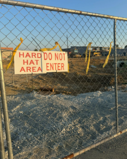 A sign on the construction zone. Old mill is being torn down to add on to Bullitt East.