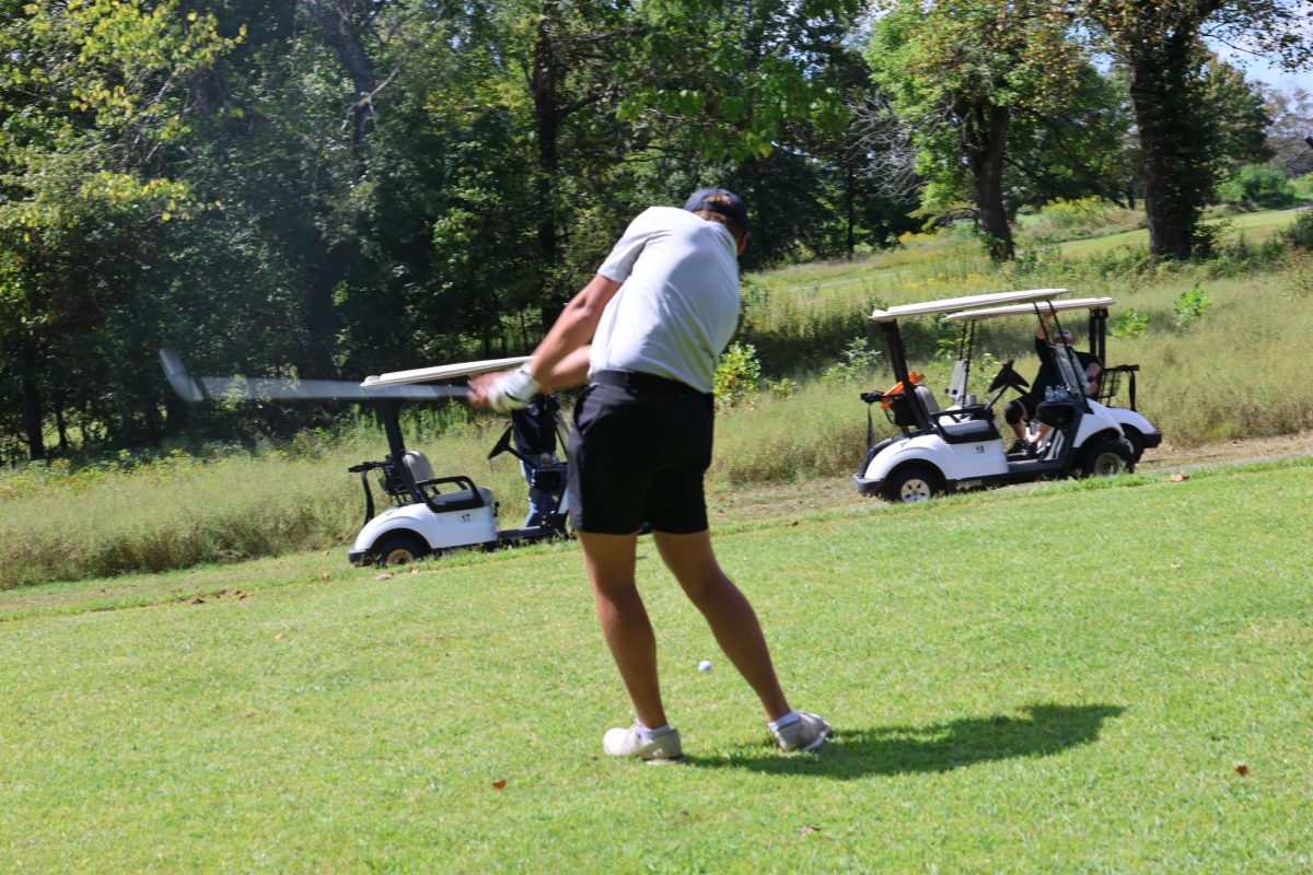 BE golfer sets up for a swing. The BE Boys Golf season has ended foe the year.